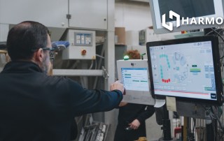 harmoni factory orchestration system being used by a machine operator