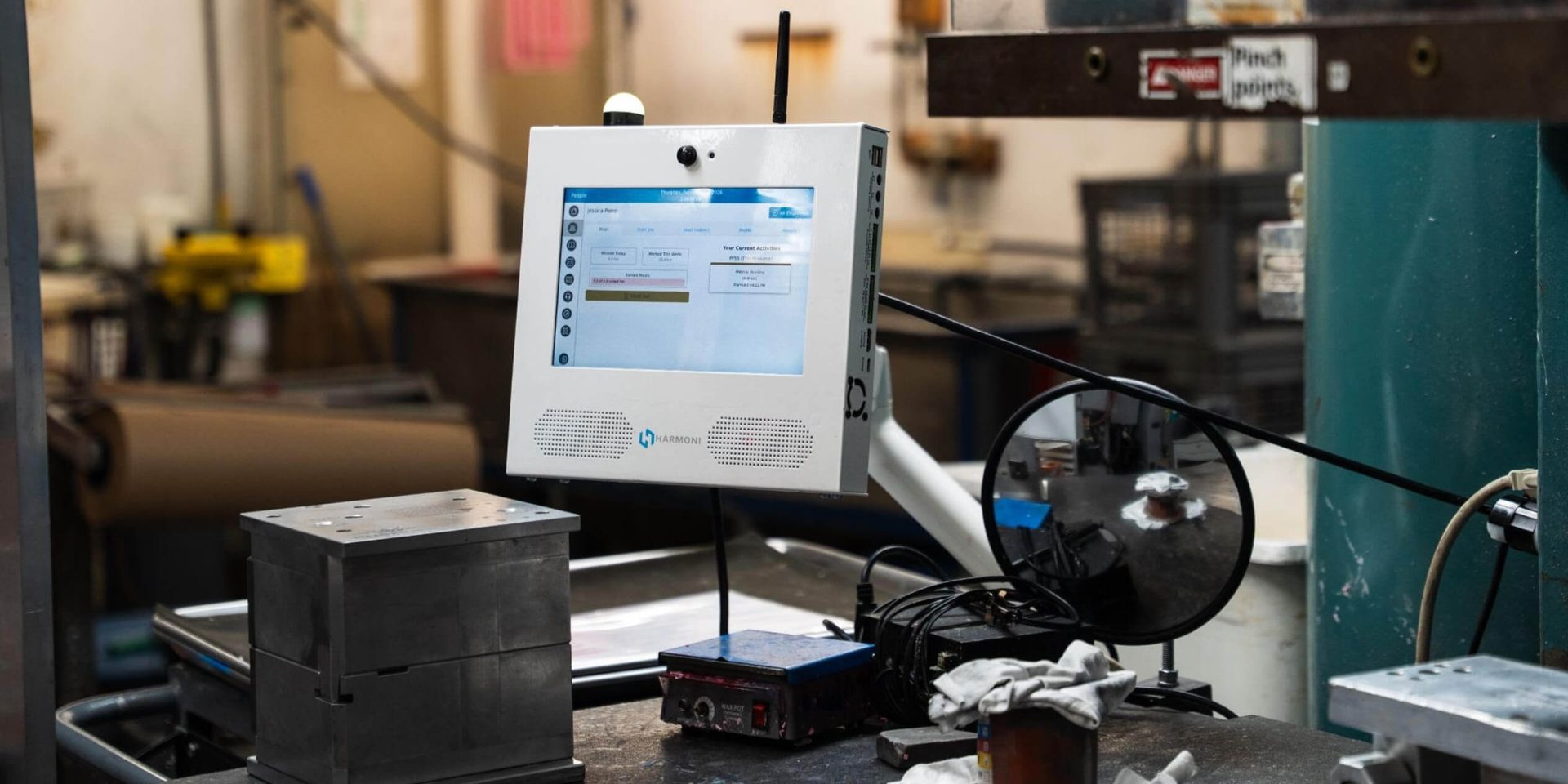 A Harmoni factory orchestration system device on a table